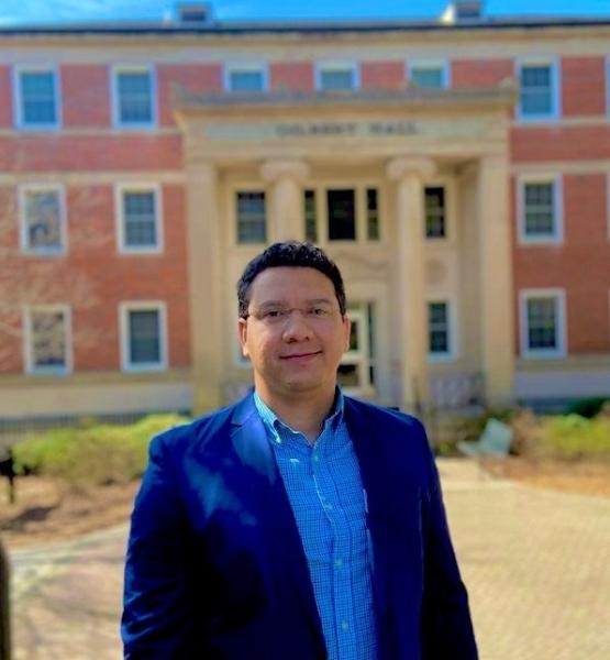 Picture of Daniel Ferreira da Silva in front of Gilbert Hall, Department of Romance Languages at the University of Georgia