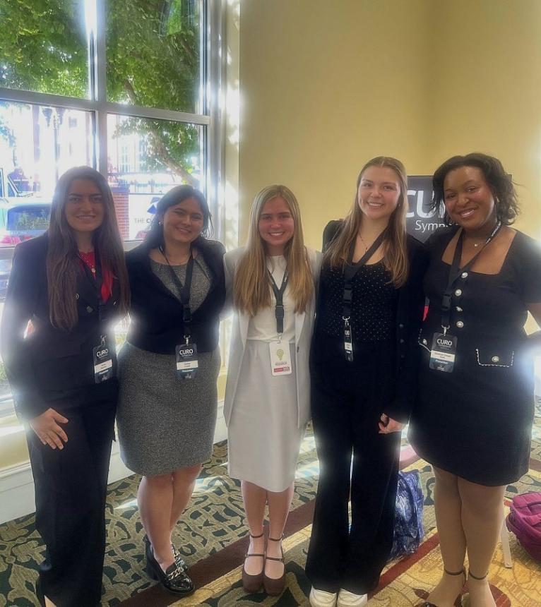 CURO team Poses before presentation