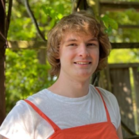 Flor in nature in an orange dress.