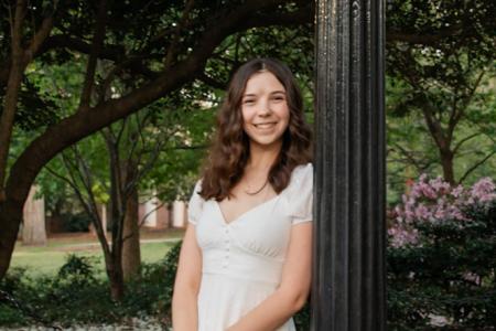 Sarah Peterson leaning on UGA Arch