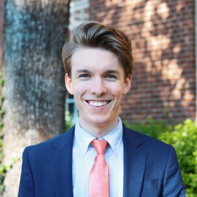 Headshot of a smiling man